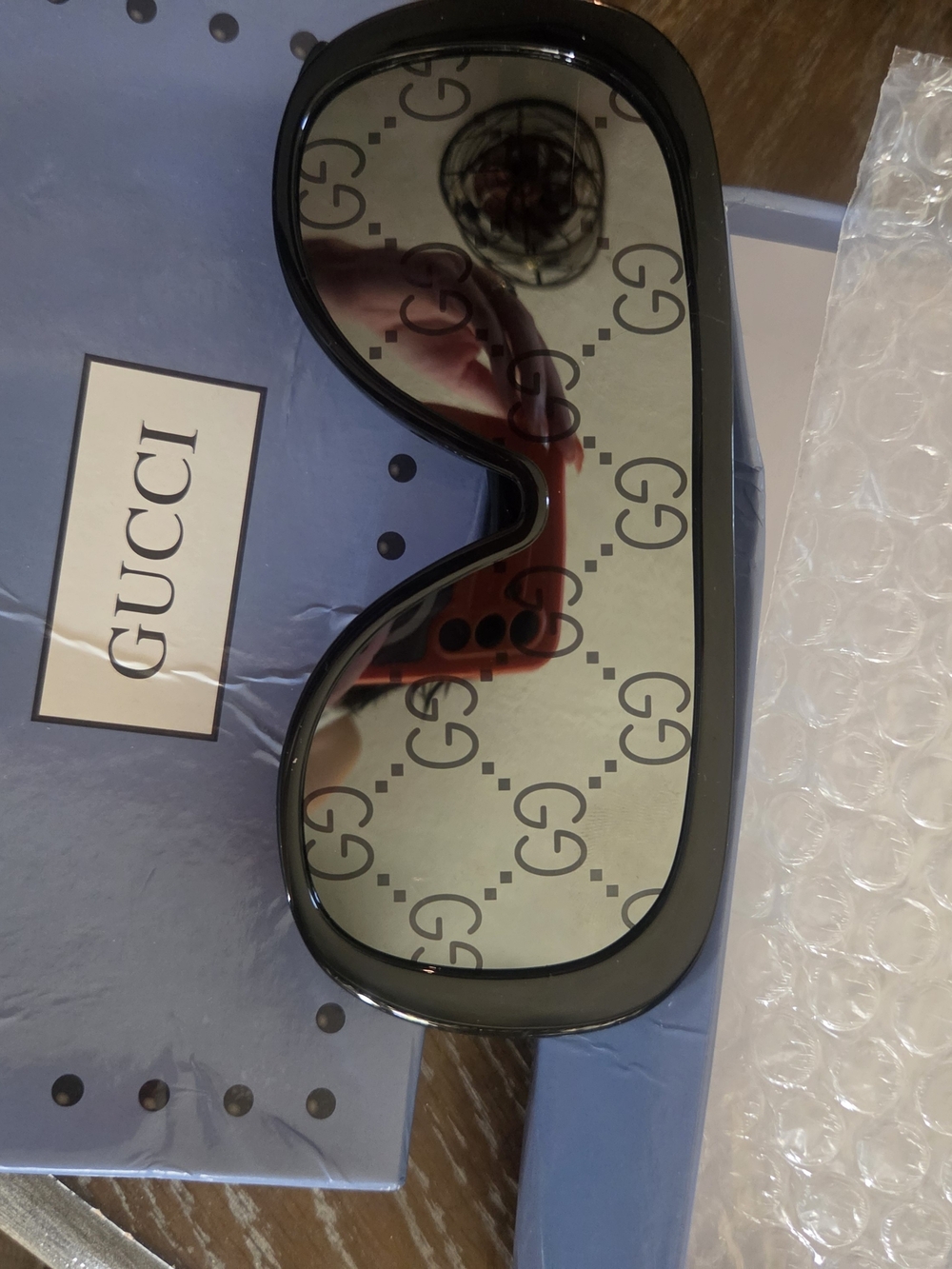 Gucci Black Frame Sunglasses with GG-Print Lenses